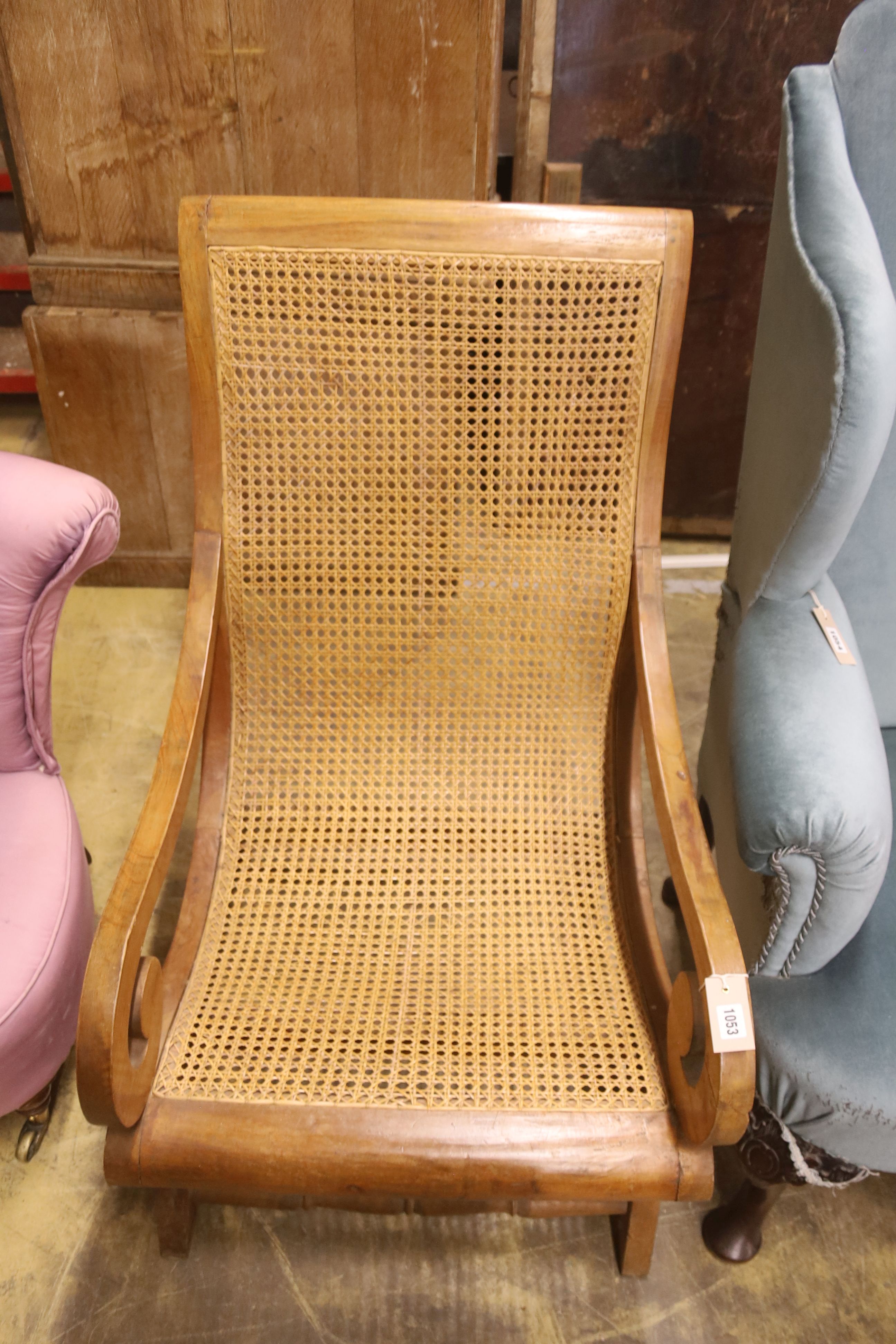 A caned hardwood plantation chair, width 59cm, depth 86cm, height 98cm